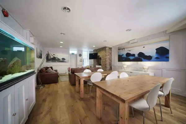Green room with sofas, makeup station and wardrobe rail at Mount Pleasant Studio
